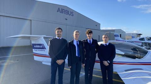 Airbus Flight Academy Cadets with their flight instructor in front of an Elixir Aircraft.