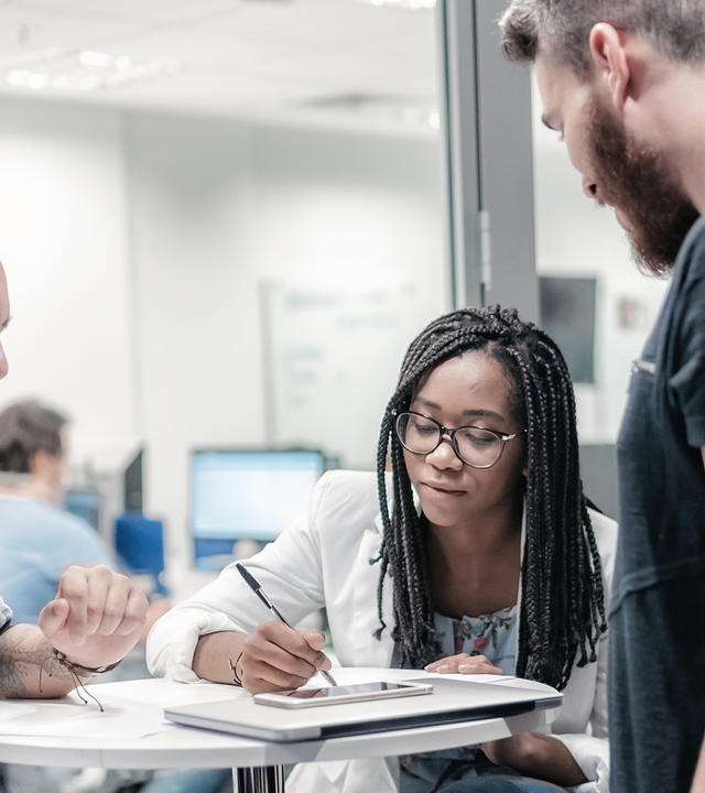 People meeting Group of people meeting at desk, ambiance